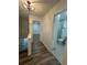 Hallway with tile flooring and a bathroom located to the right at 4022 Cortez Dr # A, Tampa, FL 33614