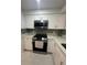Updated kitchen features stainless steel appliances, white cabinets, and granite countertops at 4022 Cortez Dr # A, Tampa, FL 33614