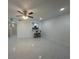 Open-concept floor plan with kitchen view to living area. Modern tile floors and bar seating at 4022 Cortez Dr # A, Tampa, FL 33614