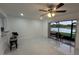 Spacious living room featuring modern tile floors and a sliding door to the patio at 4022 Cortez Dr # A, Tampa, FL 33614