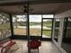 Screened porch overlooking a serene lake view with outdoor seating, perfect for relaxation at 4022 Cortez Dr # A, Tampa, FL 33614