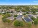 Neighborhood aerial view of residential homes and green space, showcasing a community layout at 4214 Canongate Ct, Spring Hill, FL 34609