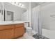 Neutral bathroom with a tub/shower combo and single vanity with ample counter space at 4124 Canongate Ct, Spring Hill, FL 34609