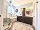 Well-lit bathroom features double vanity, soaking tub, glass shower, and modern finishes and fixtures at 4214 Canongate Ct, Spring Hill, FL 34609