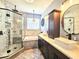 Bright bathroom boasts double vanity, soaking tub, and a luxurious glass shower with marble tile at 4214 Canongate Ct, Spring Hill, FL 34609