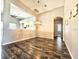 Large dining room with wood floors and an open floor plan flowing into the kitchen and living area at 4214 Canongate Ct, Spring Hill, FL 34609