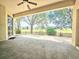 The covered patio overlooks the fenced backyard at 4214 Canongate Ct, Spring Hill, FL 34609
