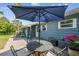 The outdoor living space in the private fenced backyard with a well manicured lawn at 4403 W Bay Court Ave, Tampa, FL 33611