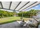 This outdoor living area has ample patio space, lush landscaping, and mature trees at 4403 W Bay Court Ave, Tampa, FL 33611