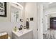 Well-lit bathroom boasts sleek vanity, dark fixtures, and white subway tile accents at 4403 W Bay Court Ave, Tampa, FL 33611