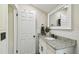 Fresh bathroom with granite countertop vanity, matte black fixtures and subway tile at 4403 W Bay Court Ave, Tampa, FL 33611
