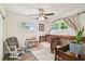 Bright Bedroom with two wood cribs, rocking chair, and views from two separate windows at 4403 W Bay Court Ave, Tampa, FL 33611