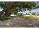 Long driveway leading to a charming home with a well-maintained front yard at 4403 W Bay Court Ave, Tampa, FL 33611