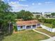 Charming single-Gathering home with a well-manicured lawn and an American flag at 4403 W Bay Court Ave, Tampa, FL 33611