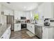 Well-lit kitchen featuring granite countertops, stainless steel appliances, and ample cabinet space at 4403 W Bay Court Ave, Tampa, FL 33611