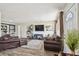 Cozy living room featuring stylish furniture, hardwood floors, and an inviting atmosphere for relaxation and entertainment at 4403 W Bay Court Ave, Tampa, FL 33611