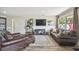 Well-lit living room with hardwood floors, comfortable seating, and an open layout perfect for entertaining guests at 4403 W Bay Court Ave, Tampa, FL 33611