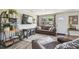 Cozy living room featuring stylish furniture, hardwood floors, and an inviting atmosphere for relaxation and entertainment at 4403 W Bay Court Ave, Tampa, FL 33611
