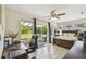 Bright main bedroom with sliding glass door leading to patio and backyard views at 4403 W Bay Court Ave, Tampa, FL 33611
