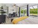 Bright and airy main bedroom with sliding glass door leading to patio and backyard views at 4403 W Bay Court Ave, Tampa, FL 33611
