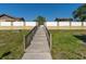 The community offers a serene walkway lined with lush greenery at 533 E Curlew Pl # 533, Tarpon Springs, FL 34689