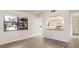 Bright living room with hardwood floors and a passthrough to the kitchen featuring white cabinets at 533 E Curlew Pl # 533, Tarpon Springs, FL 34689
