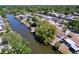 Aerial view of a home on a waterfront canal in a residential neighborhood at 5806 Liverpool Dr, Tampa, FL 33615
