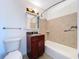 Updated bathroom features a vanity with storage and a shower-tub combo at 5806 Liverpool Dr, Tampa, FL 33615