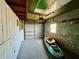 View of garage with kayak and other recreational equipment and a garage door at 5806 Liverpool Dr, Tampa, FL 33615