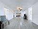 Bright living room featuring tile floors, ceiling fan, neutral paint and access to outdoor patio at 5806 Liverpool Dr, Tampa, FL 33615