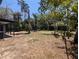 Lush backyard with ample space for recreation and a screened porch for outdoor living at 627 Riverside Dr, Tarpon Springs, FL 34689