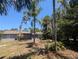 Expansive backyard with lush greenery, providing a private and serene outdoor space at 627 Riverside Dr, Tarpon Springs, FL 34689