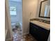 Bathroom with vanity, tile flooring, and tub and shower combo at 627 Riverside Dr, Tarpon Springs, FL 34689