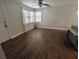 Open living space with new flooring, bright windows, and an island, perfect for modern living at 627 Riverside Dr, Tarpon Springs, FL 34689