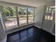 Enclosed sunroom filled with natural light, offering a relaxing indoor-outdoor space at 627 Riverside Dr, Tarpon Springs, FL 34689