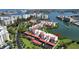 Beautiful aerial view of waterfront condos with boat docks and lush landscaping in desirable location at 7867 Sailboat Key S Blvd # 101, South Pasadena, FL 33707