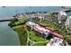 Aerial view of the property showcasing building, waterways and surrounding environment at 7867 Sailboat Key S Blvd # 101, South Pasadena, FL 33707
