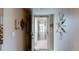 Hallway in building with a sunburst decoration, tile floor, and secured entry to the building at 7867 Sailboat Key S Blvd # 101, South Pasadena, FL 33707