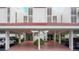 Building facade with covered parking, showcasing the entrance and well-maintained landscaping at 7867 Sailboat Key S Blvd # 101, South Pasadena, FL 33707