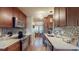Modern kitchen with stainless steel appliances, white countertops, and mosaic backsplash at 7867 Sailboat Key S Blvd # 101, South Pasadena, FL 33707