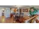 Living room area with dining area, open layout, wood floors, and waterfront views at 7867 Sailboat Key S Blvd # 101, South Pasadena, FL 33707
