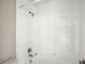 This bathroom shows white tile surround over the tub, and chrome shower fixtures at 8101 Interbay Blvd # A, Tampa, FL 33616