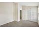 Spacious bedroom with neutral carpet and direct access to additional rooms at 8101 Interbay Blvd # A, Tampa, FL 33616