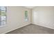 Bright, carpeted bedroom with natural light and ample space at 8101 Interbay Blvd # A, Tampa, FL 33616