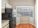 Kitchen with black appliances and a bright breakfast nook at 8101 Interbay Blvd # A, Tampa, FL 33616
