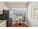 Charming breakfast nook with black appliances and a view from the bay window at 8101 Interbay Blvd # A, Tampa, FL 33616