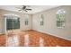 Spacious living room with beautiful tile floors and natural light streaming through the windows and sliding glass door at 8101 Interbay Blvd # A, Tampa, FL 33616