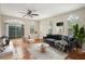 Bright living room featuring tile floors, neutral walls, arched windows and a glass sliding door to the outside at 8101 Interbay Blvd # A, Tampa, FL 33616
