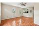 Comfortable living room with beautiful tile floors, neutral walls, arch windows and a partial view of the kitchen at 8101 Interbay Blvd # A, Tampa, FL 33616