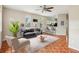 Inviting living room with neutral walls, open floor plan, tile flooring and a partial view of the kitchen at 8101 Interbay Blvd # A, Tampa, FL 33616